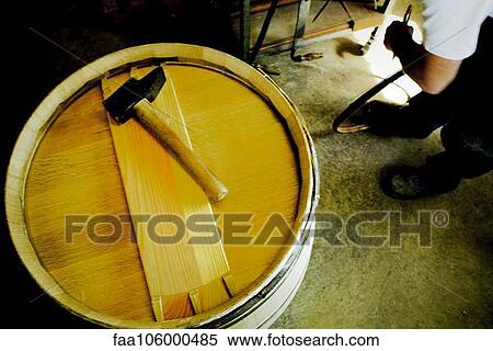 Hammer sitting on top of wine barrel View Large Photo Image Stock Photography - Hammer sitting on top of wine barrel. Fotosearch