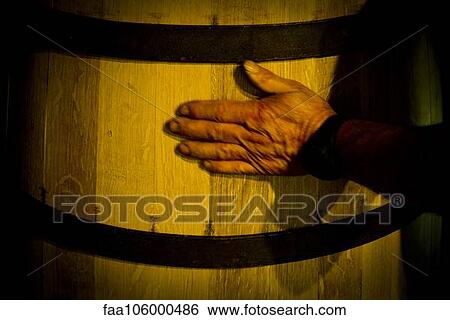 Hand touching wooden cask View Large Photo Image Stock Photograph - Hand touching wooden cask. Fotosearch