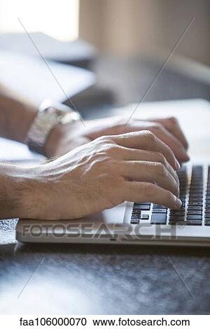 Hands typing on laptop computer keyboard View Large Photo Image Stock Image - Hands typing on laptop computer keyboard. Fotosearch