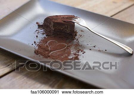 Heart drawn in cocoa powder and half eaten chocolate cake View Large Photo Image Stock Image - Heart drawn in cocoa powder and half eaten chocolate cake. Fotosearch