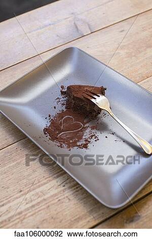Heart drawn in cocoa powder and half eaten chocolate cake View Large Photo Image Stock Image - Heart drawn in cocoa powder and half eaten chocolate cake. Fotosearch