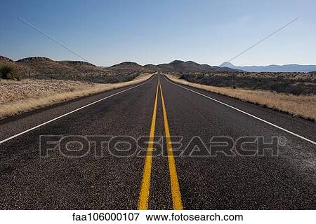 Highway through arid landscape View Large Photo Image Stock Photo - Highway through arid landscape. Fotosearch