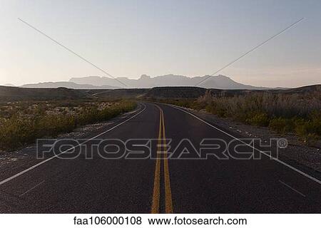Highway through arid landscape View Large Photo Image Stock Photo - Highway through arid landscape. Fotosearch