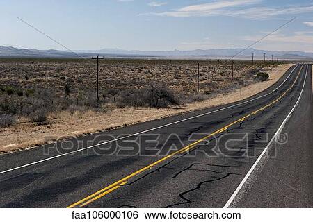 Highway through desert landscape View Large Photo Image Stock Photograph - Highway through desert landscape. Fotosearch