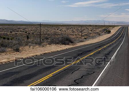 Highway through desert landscape View Large Photo Image Stock Photograph - Highway through desert landscape. Fotosearch