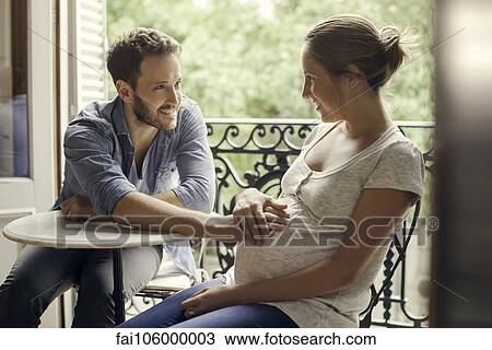 Husband resting hand on wife's pregnant stomach View Large Photo Image Stock Image - Husband resting hand on wife's pregnant stomach. Fotosearch