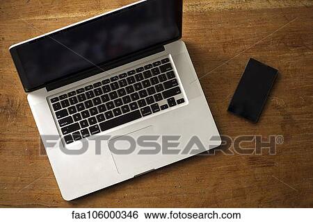 Laptop computer and smartphone View Large Photo Image Stock Photograph - Laptop computer and smartphone. Fotosearch