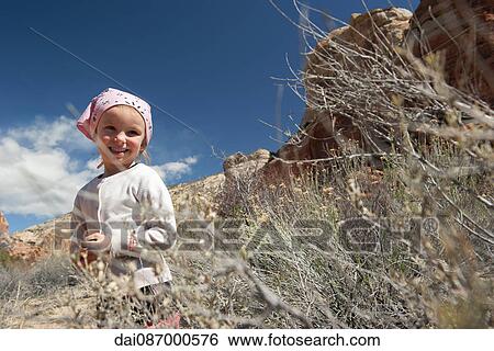 Stock Photograph - Little girl hiking in nature. Fotosearch
