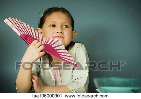 Little girl holding fan, portrait View Large Photo Image Stock Image - Little girl holding fan, portrait. Fotosearch