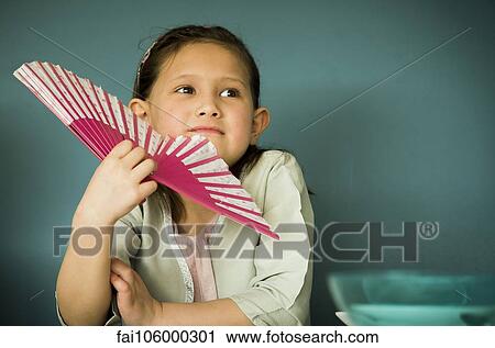 Little girl holding fan, portrait View Large Photo Image Stock Image - Little girl holding fan, portrait. Fotosearch