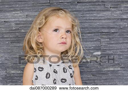 Little girl looking up in thought, portrait View Large Photo Image Stock Photo - Little girl looking up in thought, portrait. Fotosearch