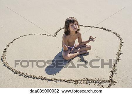 Little girl meditating on beach View Large Photo Image Stock Image - Little girl meditating on beach. Fotosearch
