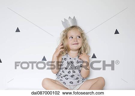 Little girl wearing paper crown View Large Photo Image Stock Image - Little girl wearing paper crown. Fotosearch