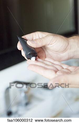 Man applying moisturizer to hands, cropped View Large Photo Image Stock Image - Man applying moisturizer to hands, cropped. Fotosearch