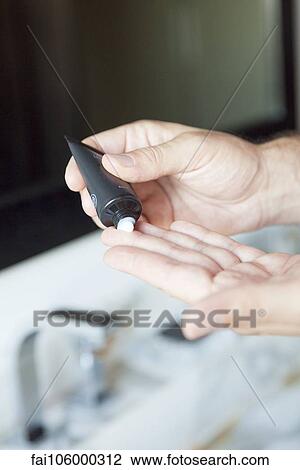 Man applying moisturizer to hands, cropped View Large Photo Image Stock Image - Man applying moisturizer to hands, cropped. Fotosearch