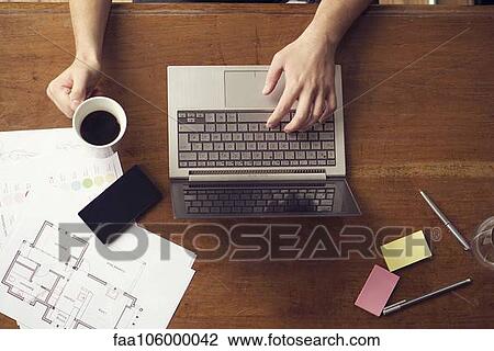 Man at work using laptop View Large Photo Image Stock Image - Man at work using laptop. Fotosearch