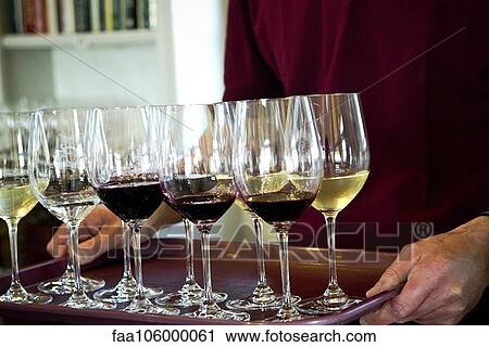 Man carrying glasses of wine in tray View Large Photo Image Stock Image - Man carrying glasses of wine in tray. Fotosearch
