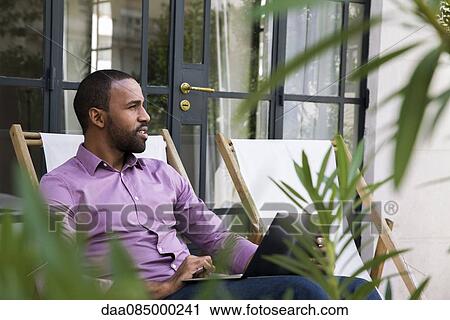 Man daydreaming outdoors View Large Photo Image Stock Image - Man daydreaming outdoors. Fotosearch