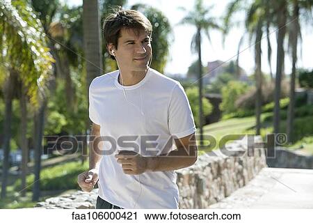 Man jogging in park View Large Photo Image Stock Image - Man jogging in park. Fotosearch