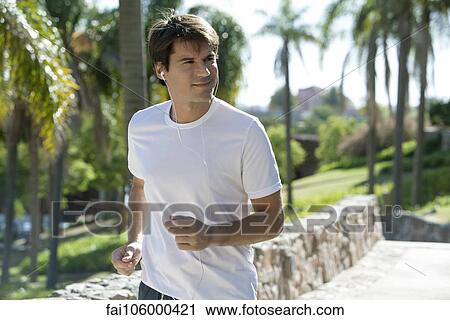 Man jogging in park View Large Photo Image Stock Image - Man jogging in park. Fotosearch