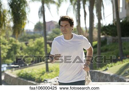 Man jogging in park View Large Photo Image Stock Photography - Man jogging in park. Fotosearch