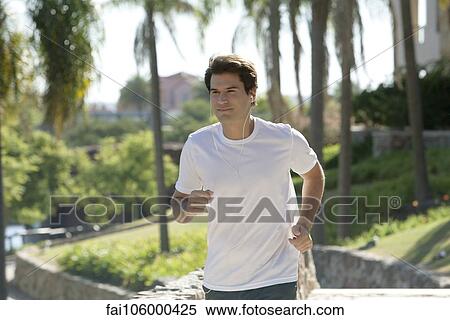 Man jogging in park View Large Photo Image Stock Photography - Man jogging in park. Fotosearch