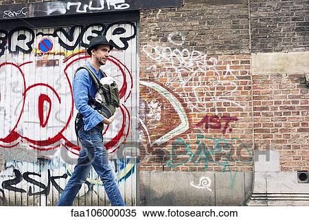 Man taking baby with him while running errands in the city View Large Photo Image Stock Photography - Man taking baby with him while running errands in the city. Fotosearch