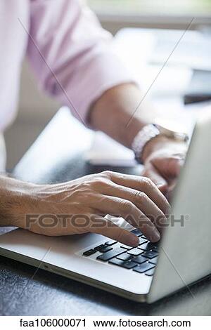 Man using laptop computer, cropped View Large Photo Image Stock Image - Man using laptop computer, cropped. Fotosearch