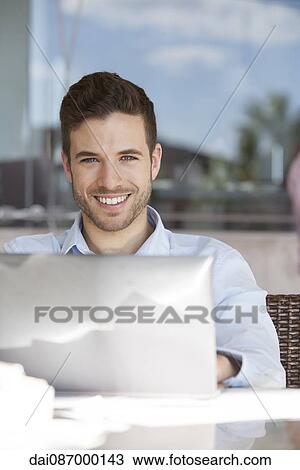 Man using laptop computer View Large Photo Image Stock Image - Man using laptop computer. Fotosearch