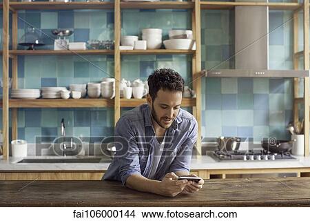 Man using smartphone View Large Photo Image Picture - Man using smartphone. Fotosearch