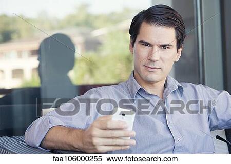 Man using smartphone, portrait View Large Photo Image Stock Photography - Man using smartphone, portrait. Fotosearch