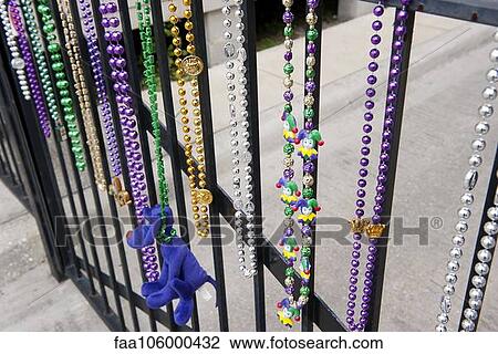 Mardi gras beads hanging on railing in New Orleans, Louisiana, USA View Large Photo Image Stock Image - Mardi gras beads hanging on railing in New Orleans, Louisiana, USA. Fotosearch