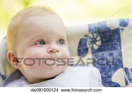 Messy baby eating, portrait View Large Photo Image Picture - Messy baby eating, portrait. Fotosearch