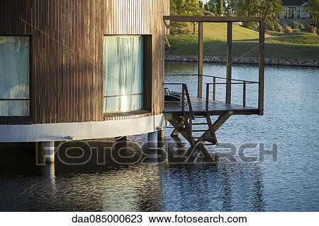 Modern lakehouse on water View Large Photo Image Stock Image - Modern lakehouse on water. Fotosearch