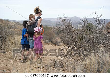 Mother and children hiking in the desert, Big Bend National Park, Texas, USA View Large Photo Image Stock Photo - Mother and children hiking in the desert, Big Bend National Park, Texas, USA. Fotosearch