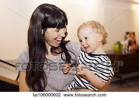 Mother and toddler, portrait View Large Photo Image Stock Image - Mother and toddler, portrait. Fotosearch