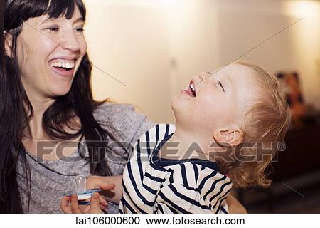 Mother and toddler sharing laugh View Large Photo Image Stock Image - Mother and toddler sharing laugh. Fotosearch