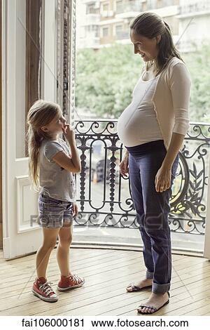 Mother preparing daughter for arrival of her new sibling View Large Photo Image Stock Image - Mother preparing daughter for arrival of her new sibling. Fotosearch