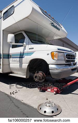 Motor home having a tire changed View Large Photo Image Stock Photo - Motor home having a tire changed. Fotosearch