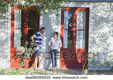 Neighbours chatting outside duplex View Large Photo Image Stock Image - Neighbours chatting outside duplex. Fotosearch