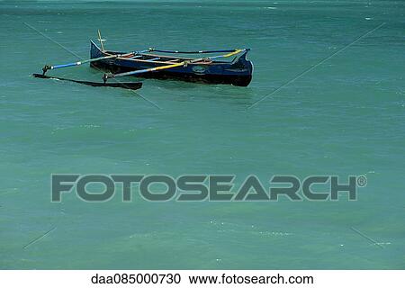 Stock Image - Outrigger canoe. Fotosearch