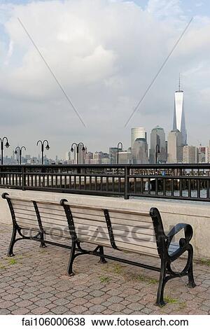 Park bench with scenic view of Lower Manhattan, New York City, New York, USA View Large Photo Image Stock Photo - Park bench with scenic view of Lower Manhattan, New York City, New York, USA. Fotosearch
