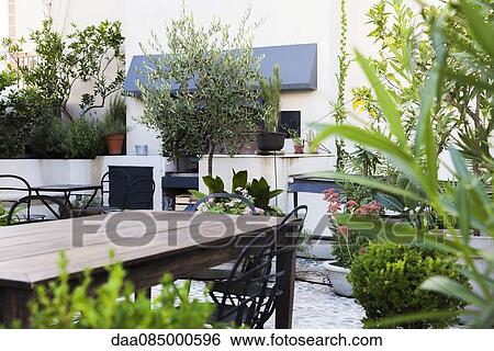 Stock Photograph - Patio furniture on hotel terrace. Fotosearch