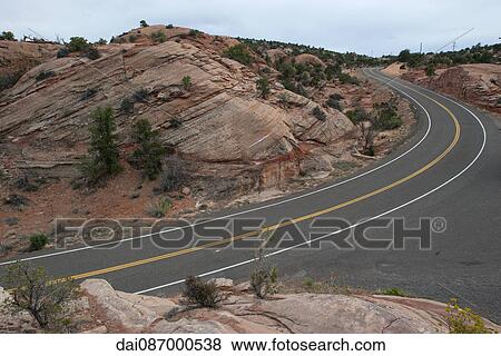Paved highway through rocky desert landscape View Large Photo Image Stock Photo - Paved highway through rocky desert landscape. Fotosearch