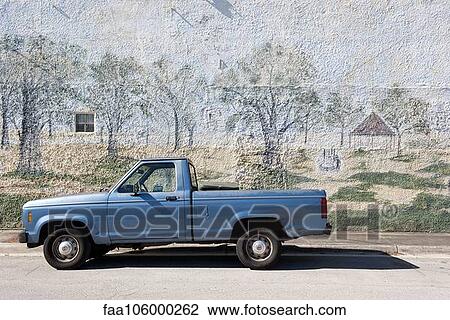 Pick-up truck parked beside wall with mural painted on it View Large Photo Image Stock Image - Pick-up truck parked beside wall with mural painted on it. Fotosearch