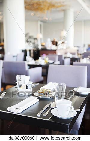 Place settings for breakfast in modern dining room View Large Photo Image Stock Image - Place settings for breakfast in modern dining room. Fotosearch
