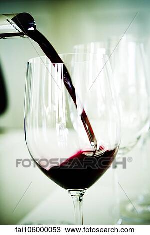 Pouring red wine View Large Photo Image Stock Image - Pouring red wine. Fotosearch