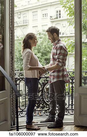 Stock Photo - Pregnant couple, portrait. Fotosearch