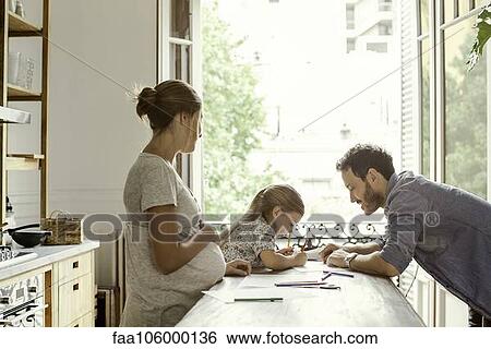 Pregnant mother watching as daughter spends quality time with father View Large Photo Image Stock Photograph - Pregnant mother watching as daughter spends quality time with father. Fotosearch