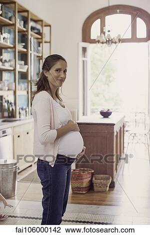 Pregnant woman at home View Large Photo Image Stock Image - Pregnant woman at home. Fotosearch
